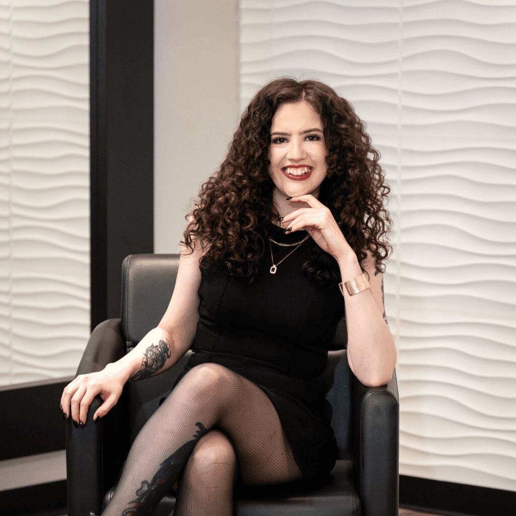 Portrait of Alex Harriott, a professional stylist at Elevate Beauty Lounge, showcasing their expertise and style.