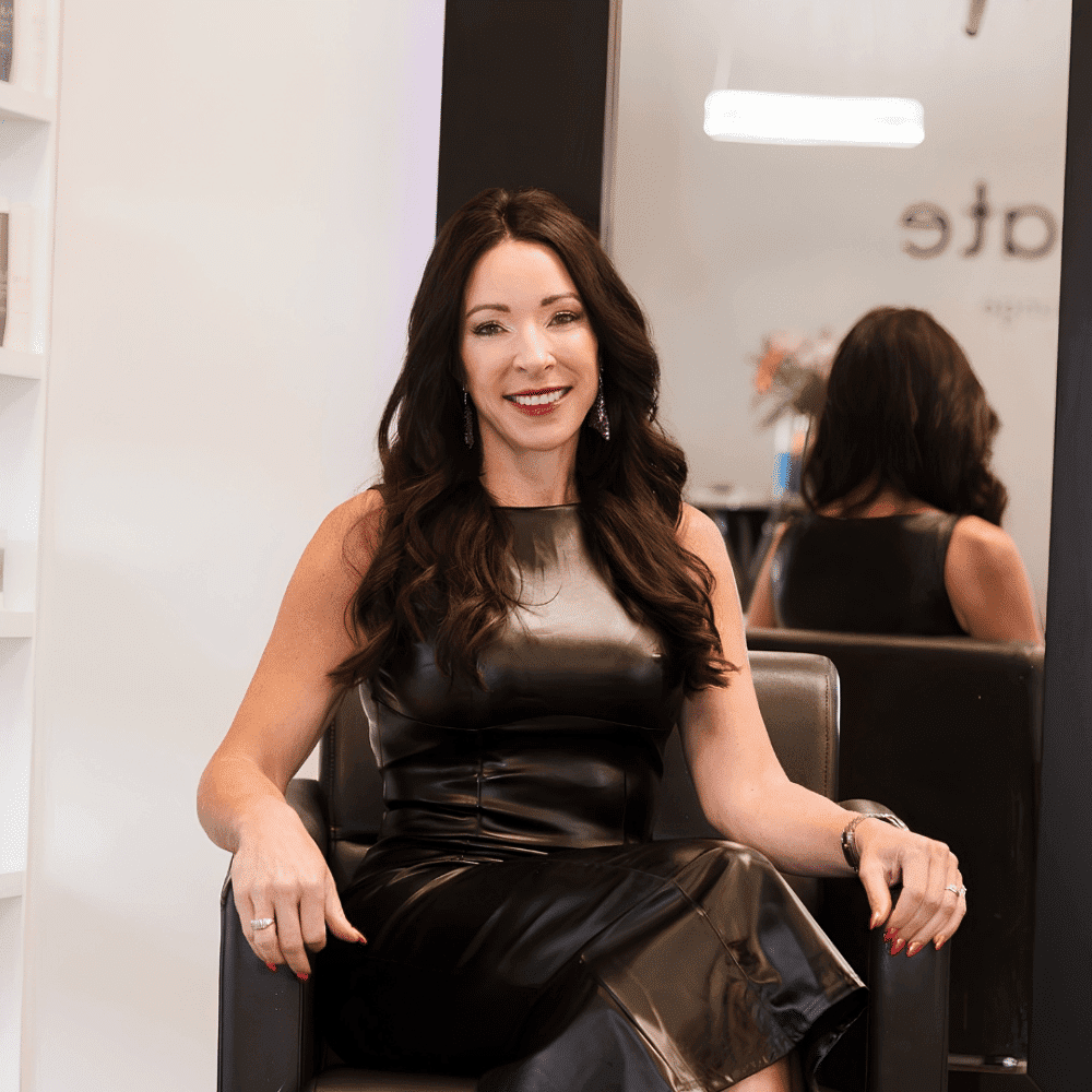 Portrait of Sarah Mitchell, a professional stylist at Elevate Beauty Lounge, showcasing their expertise and style.